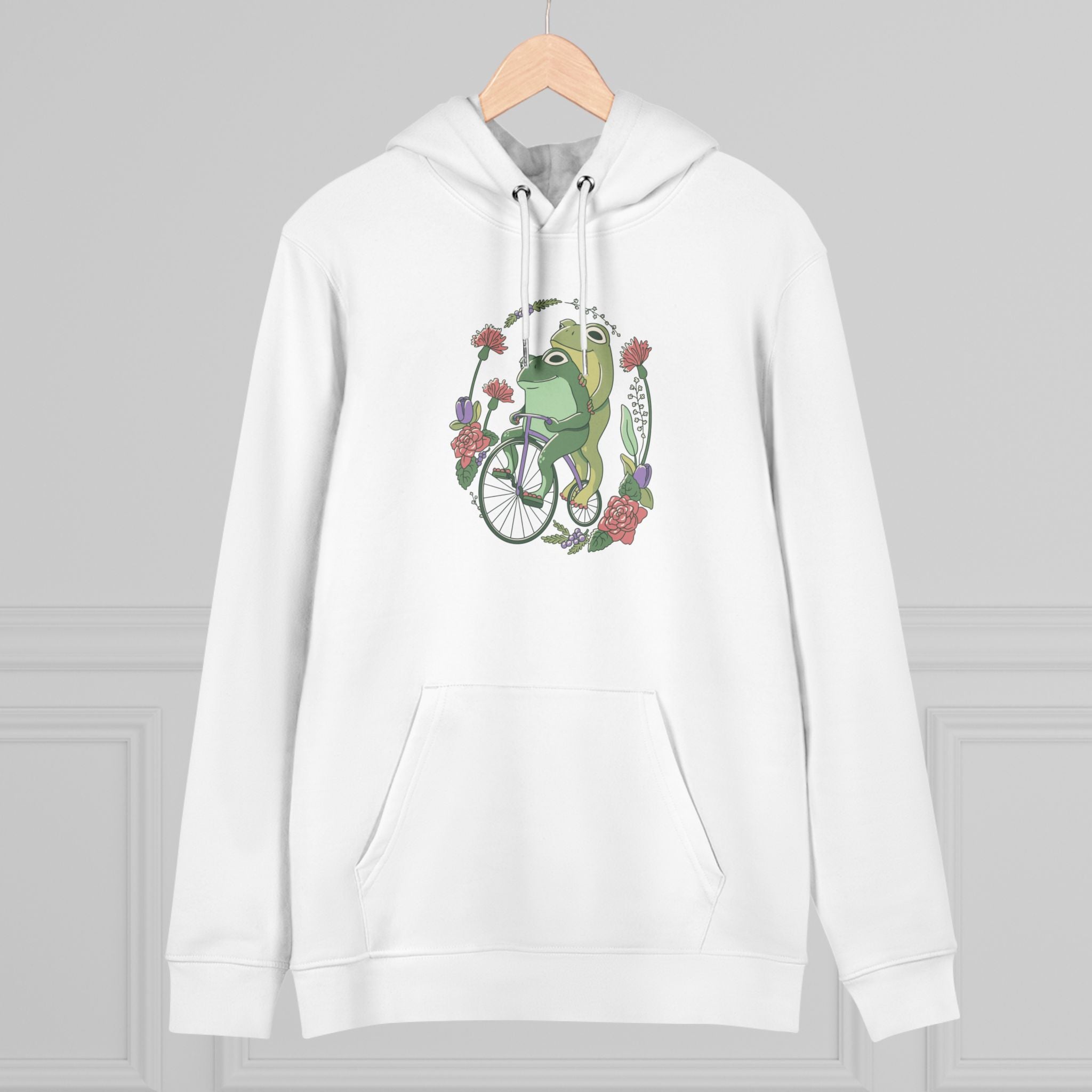 Cottagecore Unisex Hoodie Stil mit fröhlichen Fröschen auf Fahrrad