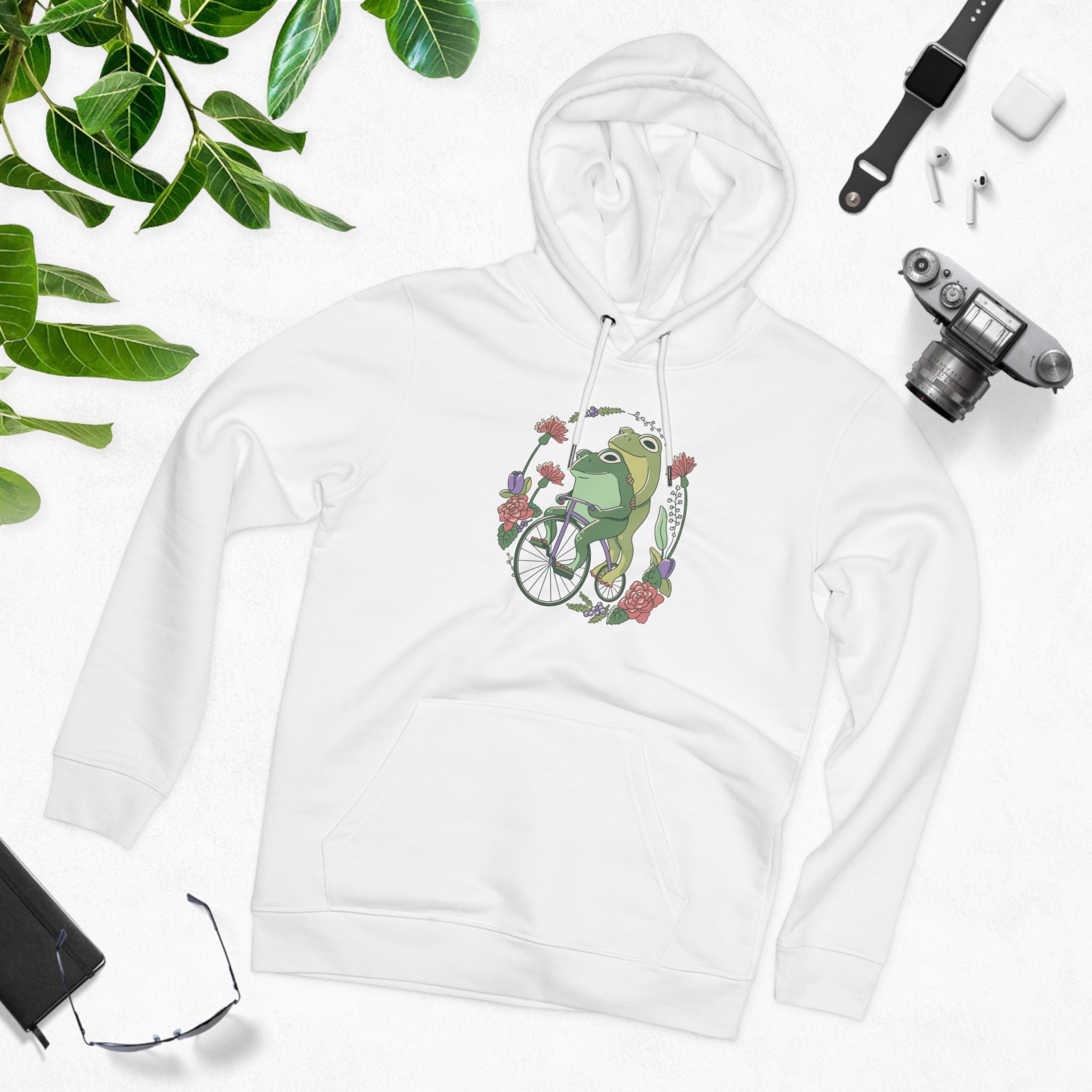 Cottagecore Unisex Hoodie Stil mit fröhlichen Fröschen auf Fahrrad